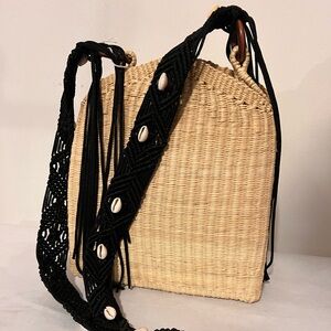 Sensi straw crossbody summer handbag with black straps and cowrie shells